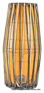 The mridangam is a percussion instrument of ancient origin primary rhythmic accompaniment in a Carnatic music ensemble.