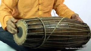 The mridangam is a percussion instrument of ancient origin primary rhythmic accompaniment in a Carnatic music ensemble.