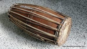 The mridangam is a percussion instrument of ancient origin primary rhythmic accompaniment in a Carnatic music ensemble.